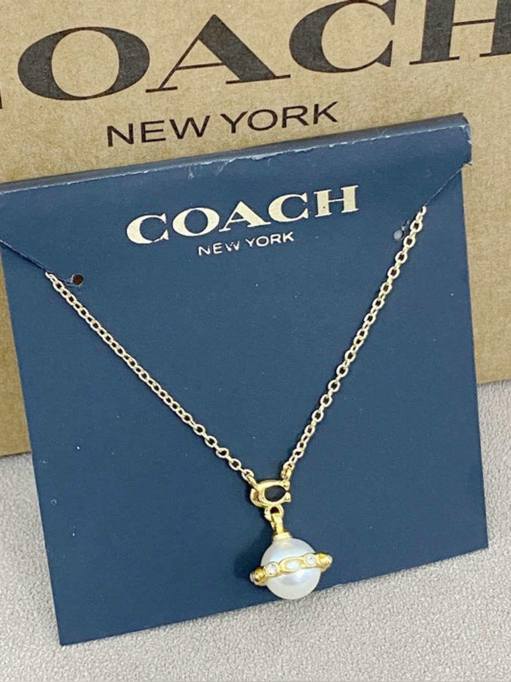 Coach Gold-Tone Pearl Orbit Pendant Necklace